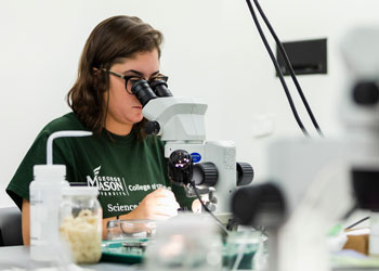 Student at Microscope