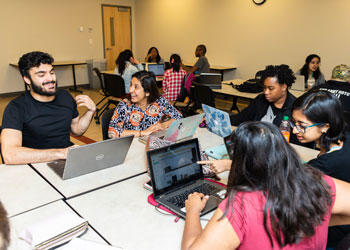 Students at tables in Mason classroom